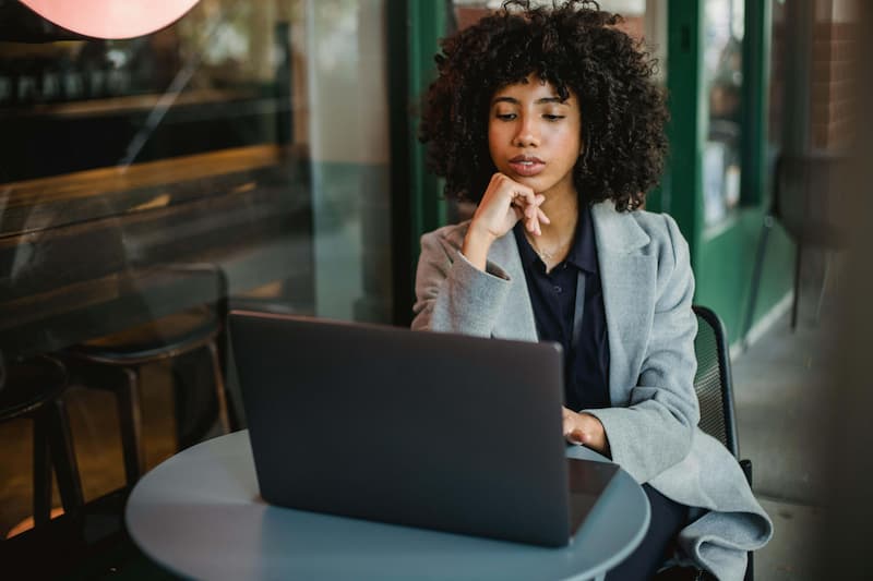 Creator sitting at her desk reflecting on a bag drop that did not go as planned