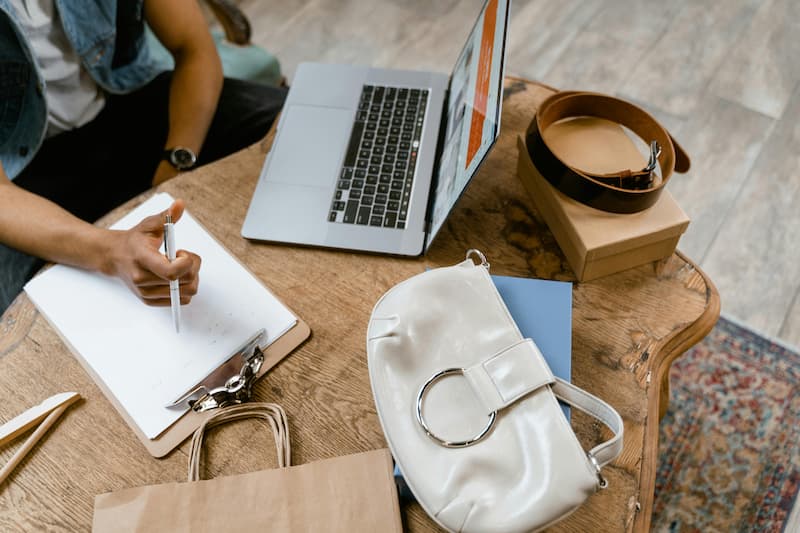 Creator at her desk planning her handbag brand launch in 2026