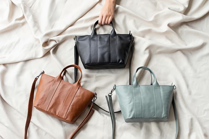 Flat lay of three handbag silhouettes representing recurring trend archetypes
