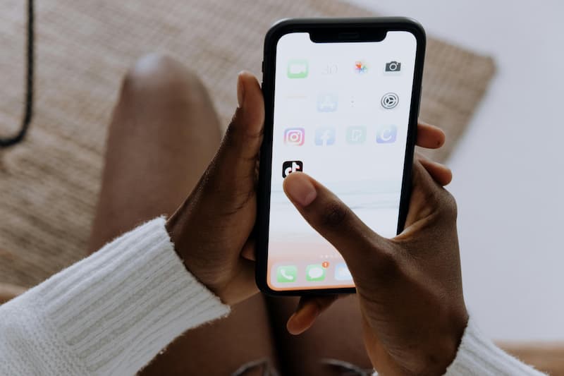 Phone screen showing TikTok search results and save count as early trend signal